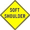 Shoulder of the road is soft. Drive on the shoulder only in emergencies