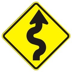 There is a winding road ahead. Drive slowly and carefully, and do not pass.