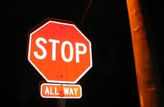 These signs are added to a stop sign advising that all approaching traffic to this intersection must stop. (tiny one)