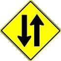 Warning that you are leaving a separated one-way highway and will soon be driving on a two-way highway