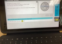 What is the area of the circle on the paper to the nearest tenth