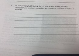 How does Dr. King respond to being labeled an extremist and how does his use of the word extremist contribute to the tone of the text.